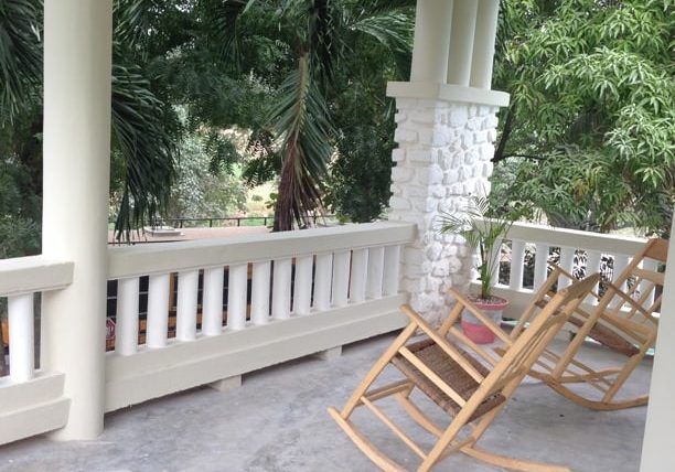 front porch with haitian rocking chairs